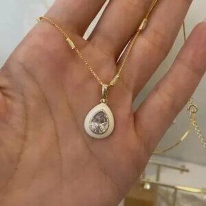 18k gold plated. White crystal stone with enamel  Size: 15 mm